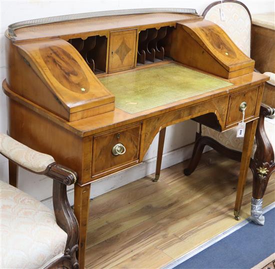 A George III style banded and inlaid mahogany Carlton House desk W.107cm